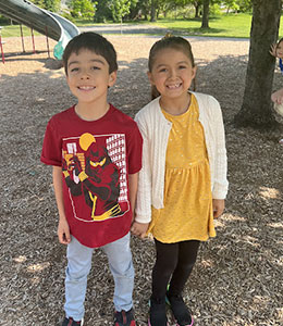 Two students smiling in the playground